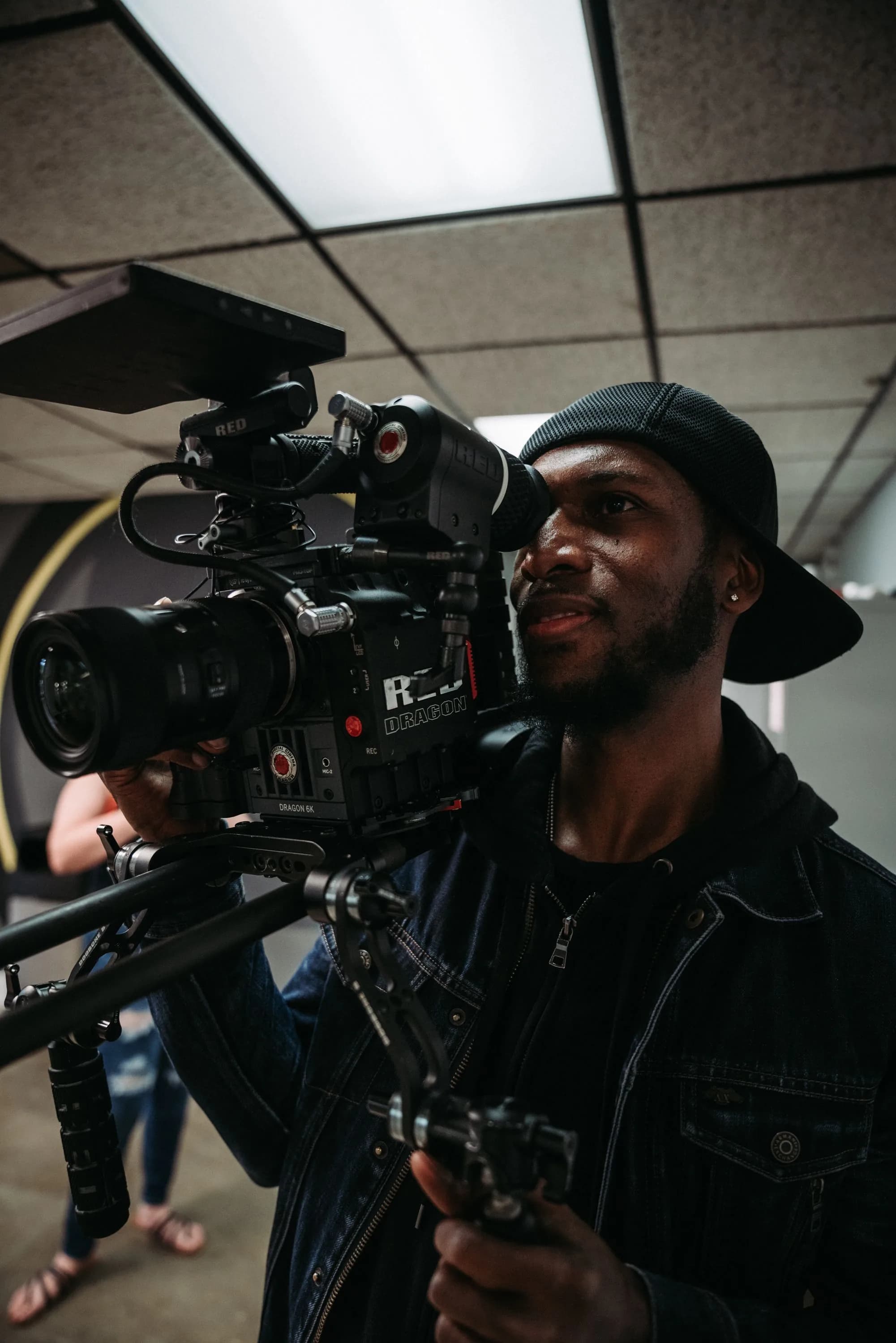 Kezmak Digital cinematographer operating a cinema camera