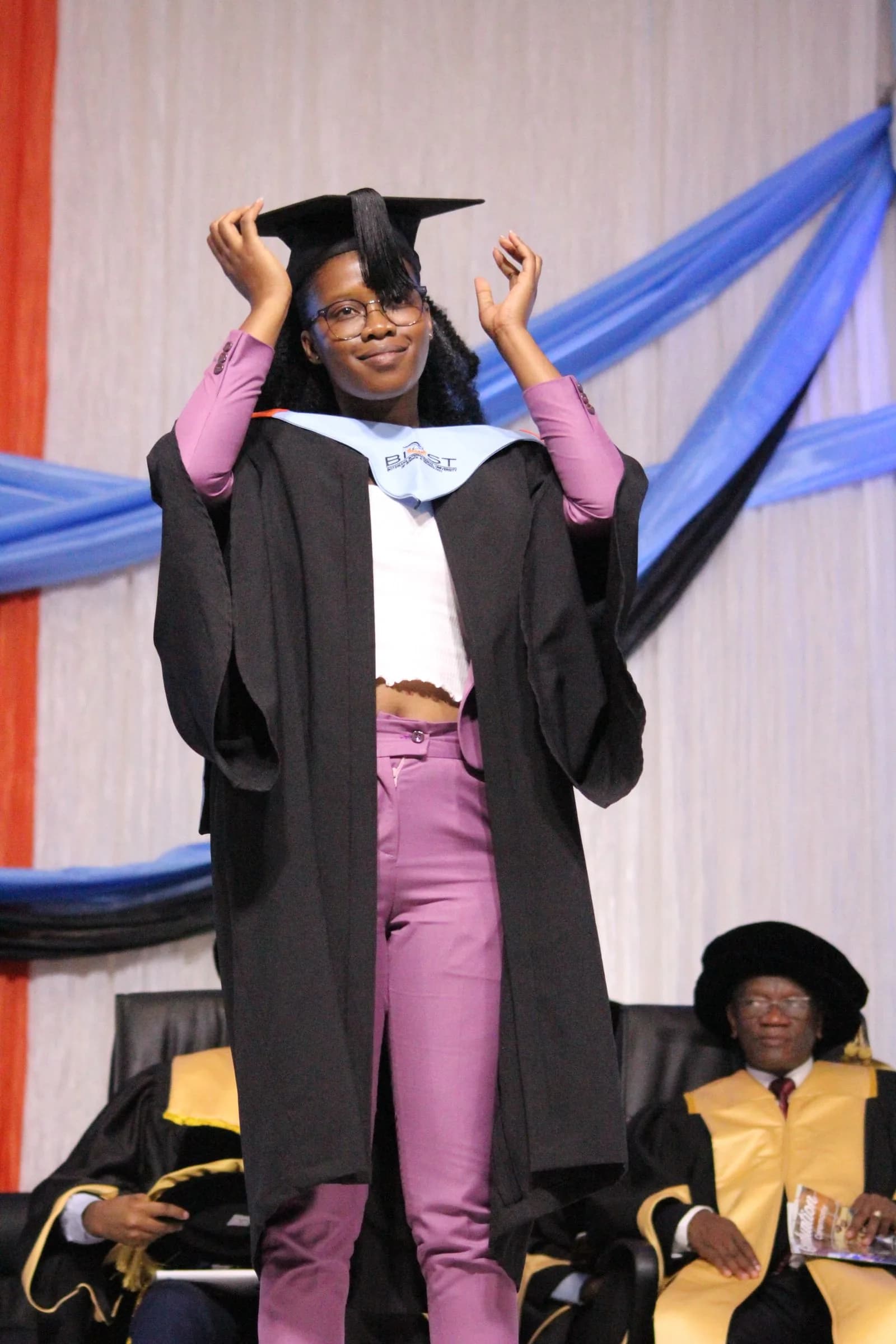 Graduate crossing the stage
