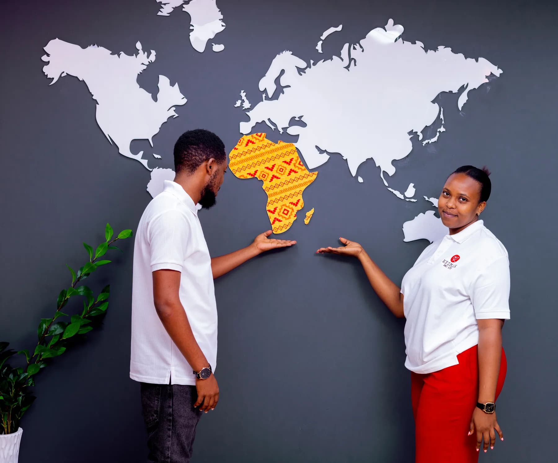 Kezmak team beside a world map with Africa highlighted