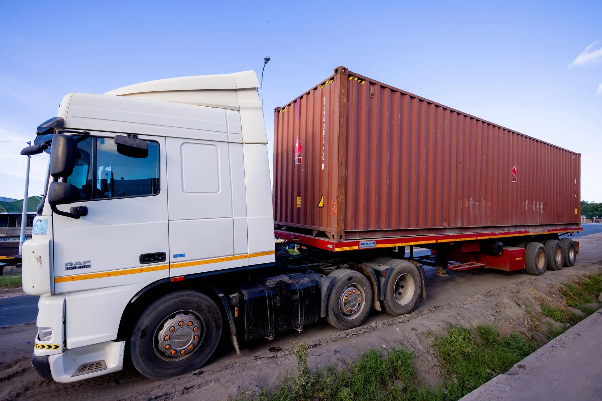 Kezmak truck hauling a shipping container